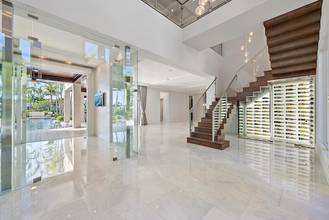 177 Commodore Dr, Jupiter, FL 33477 - common area featuring a towering ceiling and stairway