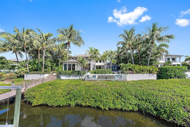 177 Commodore Dr, Jupiter, FL 33477 - back of house featuring a water view and fence