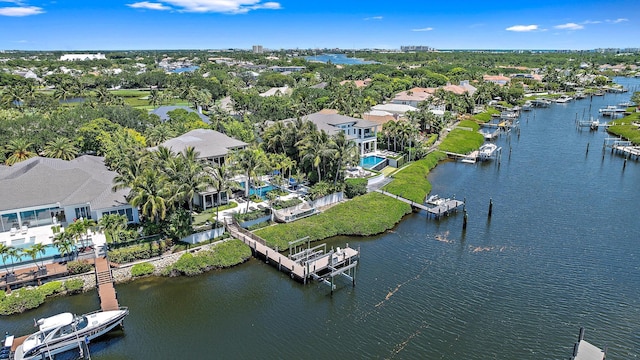 177 Commodore Dr, Jupiter, FL 33477 - aerial view of residential area with a large body of water and a tree filled landscape