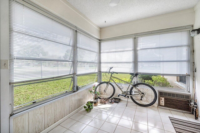 sunroom / solarium with an AC wall unit