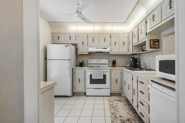 kitchen featuring tasteful backsplash, sink, light tile patterned floors, ceiling fan, and white appliances