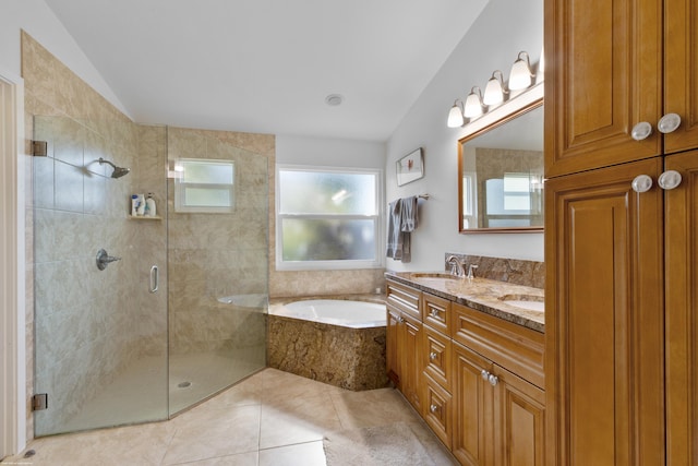 bathroom featuring tile patterned flooring, vanity, vaulted ceiling, and shower with separate bathtub