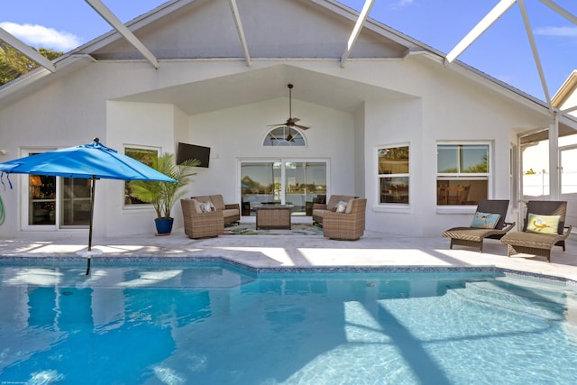 rear view of property with an outdoor living space, a patio, a lanai, and ceiling fan