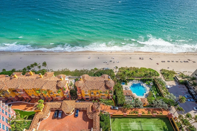 bird's eye view featuring a view of the beach and a water view