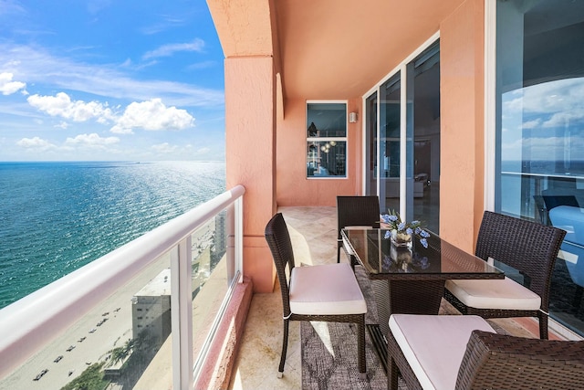 balcony featuring a water view