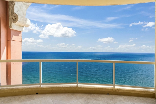 balcony featuring a water view