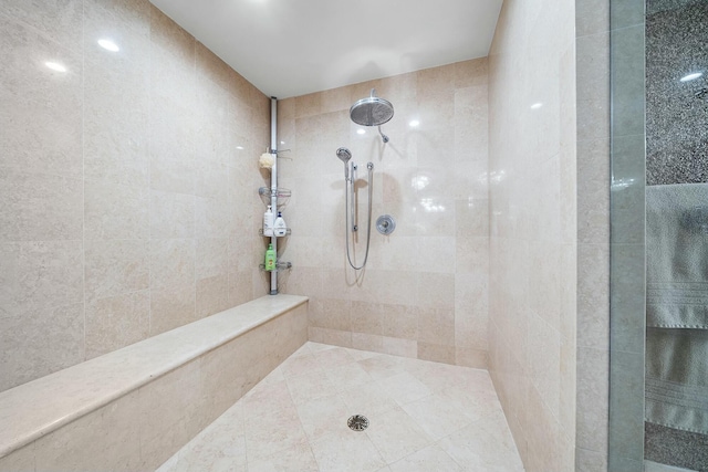 bathroom with a tile shower