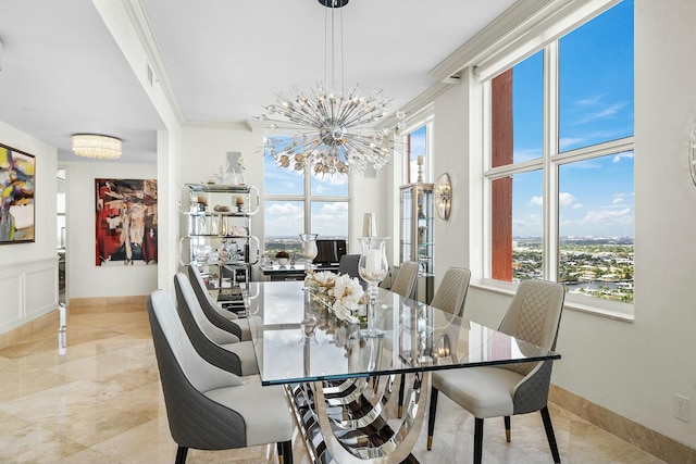 dining room featuring crown molding and a chandelier