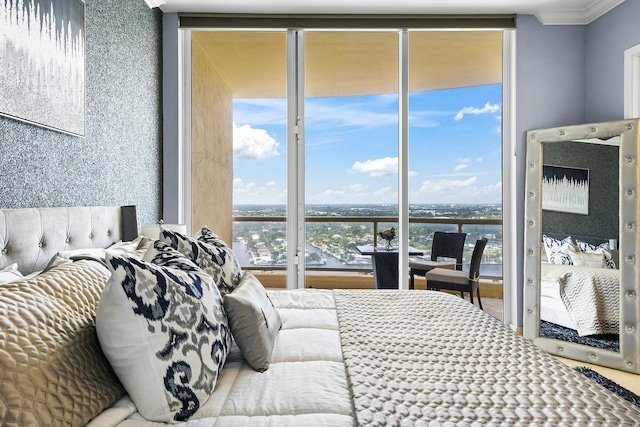 bedroom with expansive windows and crown molding