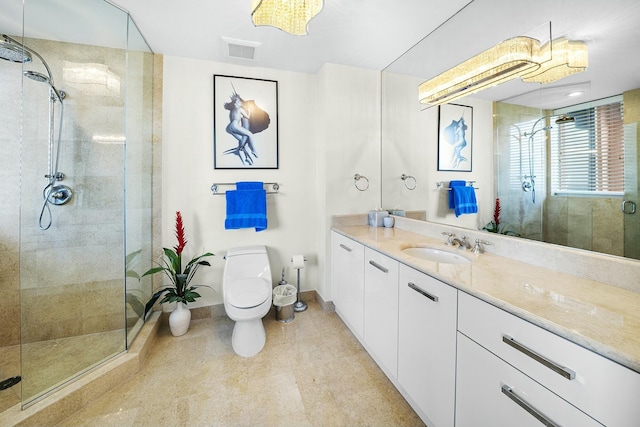 bathroom featuring walk in shower, vanity, and toilet