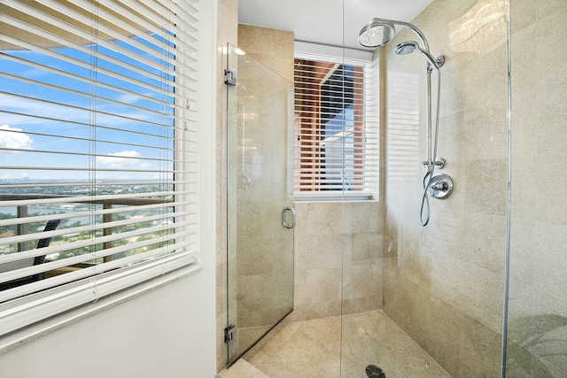 bathroom with a water view and walk in shower