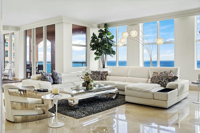 sunroom with a water view and a healthy amount of sunlight