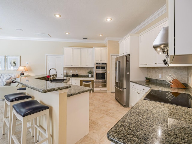 kitchen with a center island with sink, white cabinetry, appliances with stainless steel finishes, and exhaust hood