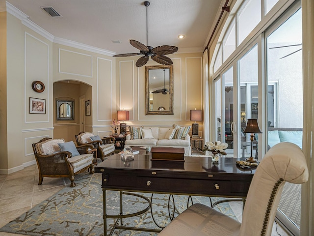 tiled living room featuring ceiling fan and ornamental molding