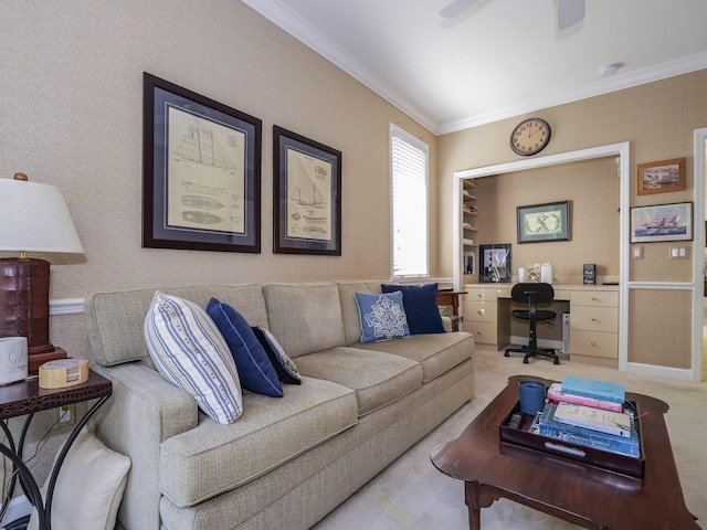 carpeted living room featuring ornamental molding and ceiling fan