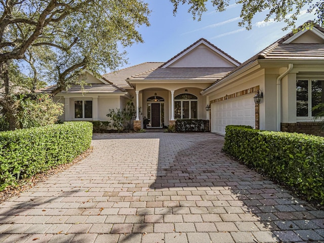 single story home featuring a garage