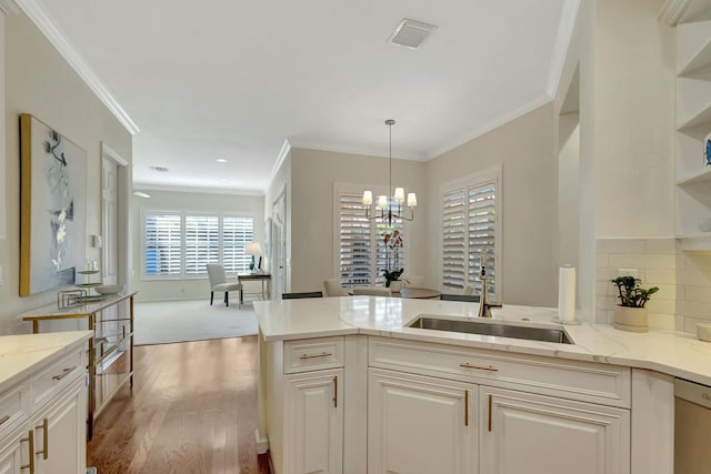 106 Via Santa Cruz, Jupiter, FL 33458 - kitchen featuring a sink, dishwasher, open shelves, crown molding, and light stone countertops
