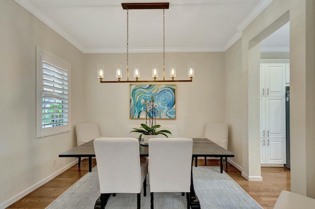 106 Via Santa Cruz, Jupiter, FL 33458 - dining space featuring wood finished floors, crown molding, baseboards, and a chandelier