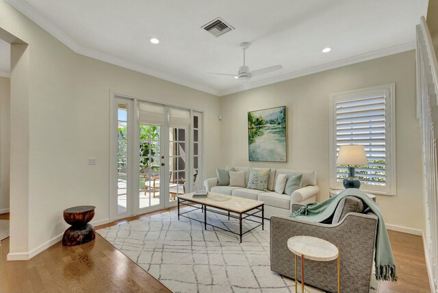 106 Via Santa Cruz, Jupiter, FL 33458 - kitchen with stainless steel appliances, a sink, crown molding, light wood finished floors, and tasteful backsplash