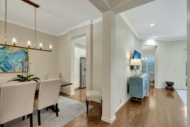 106 Via Santa Cruz, Jupiter, FL 33458 - dining room with wood finished floors, baseboards, crown molding, recessed lighting, and a chandelier
