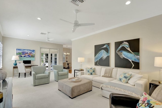 living room featuring crown molding, carpet floors, ceiling fan with notable chandelier, and french doors