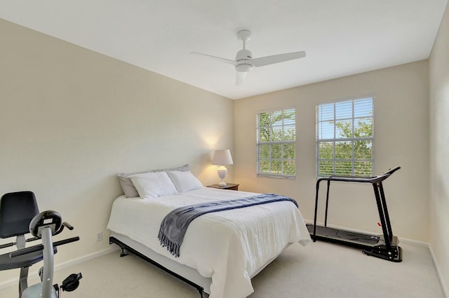 bedroom featuring light colored carpet and ceiling fan