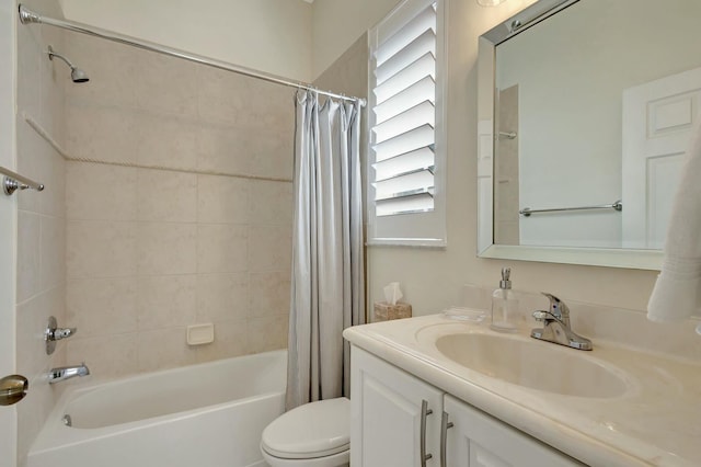 full bathroom featuring vanity, shower / bath combination with curtain, and toilet