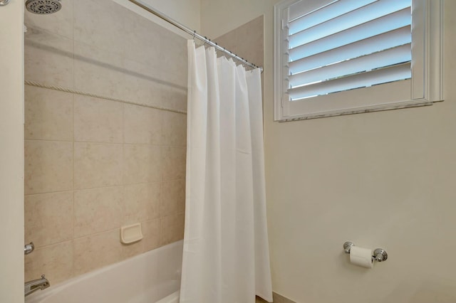 bathroom with shower / bath combo