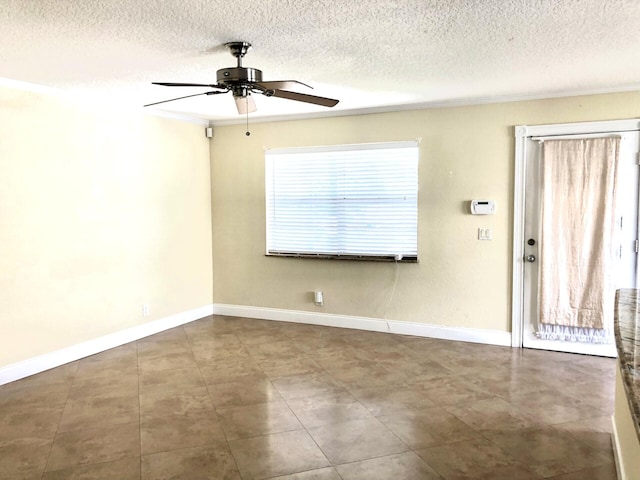 unfurnished room with crown molding, ceiling fan, and a textured ceiling