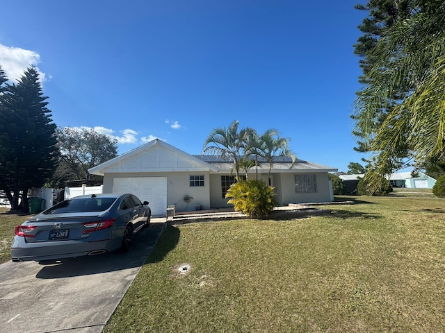 single story home with a garage and a front yard