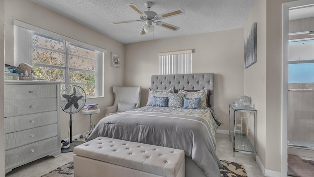 bedroom featuring ceiling fan and a textured ceiling