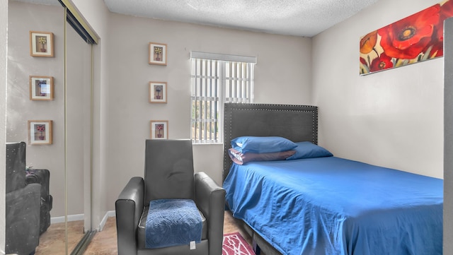 bedroom featuring a closet and a textured ceiling