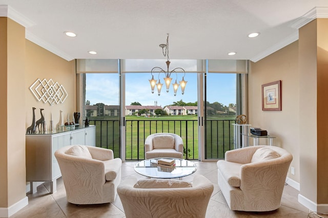 living area with an inviting chandelier, a wall of windows, and ornamental molding