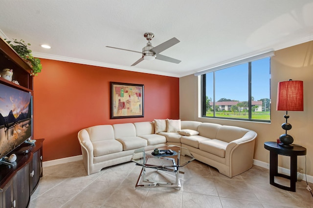 living room featuring light tile patterned floors, ornamental molding, and ceiling fan