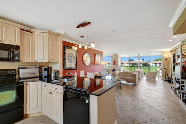 kitchen featuring decorative light fixtures, sink, light tile patterned floors, black appliances, and crown molding