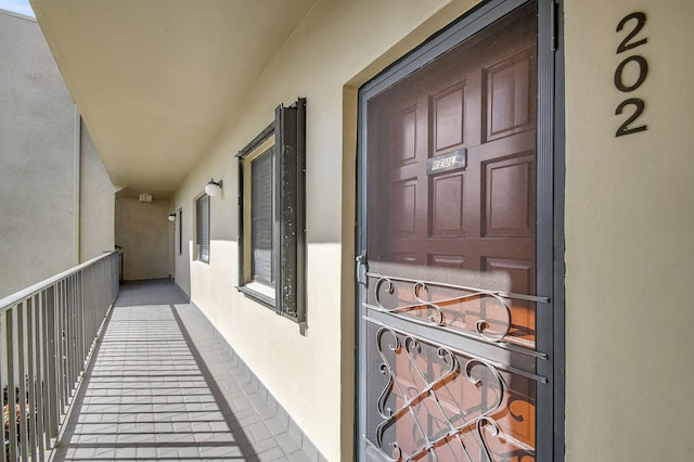 doorway to property featuring a balcony