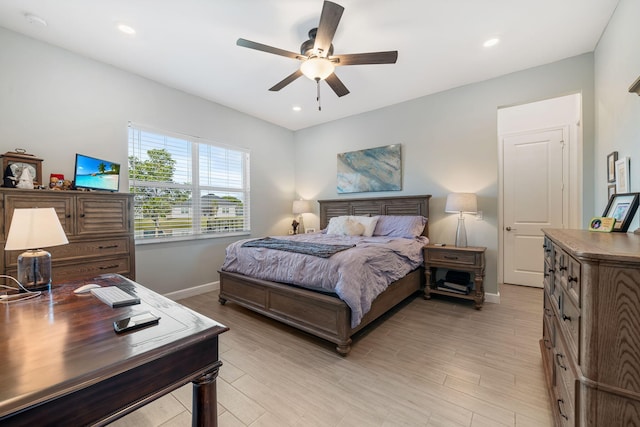 bedroom with ceiling fan and light wood-type flooring