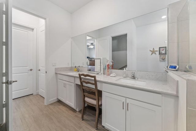 bathroom featuring vanity and wood-type flooring