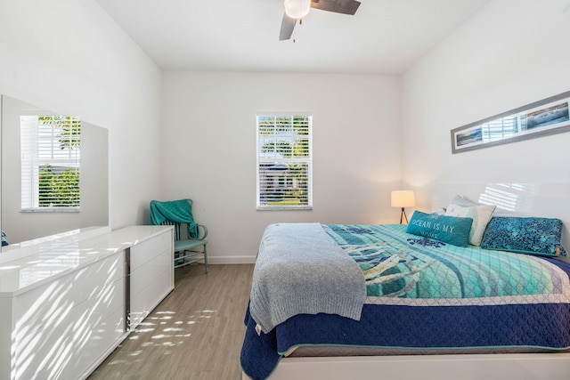 bedroom featuring wood-type flooring and ceiling fan