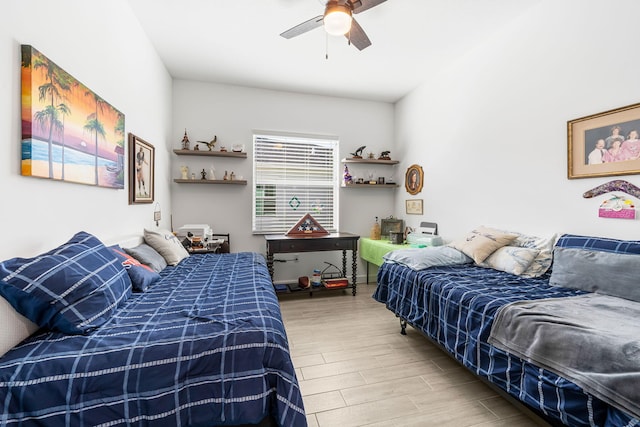 bedroom featuring hardwood / wood-style flooring and ceiling fan