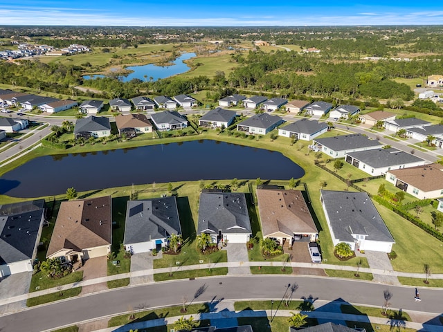 birds eye view of property featuring a water view