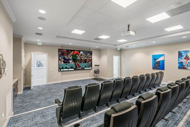 cinema room with crown molding and carpet