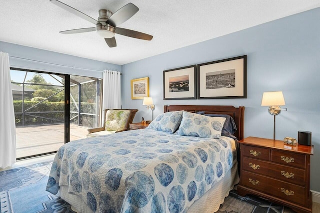 bedroom featuring ceiling fan, access to outside, and a textured ceiling