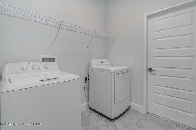 washroom featuring independent washer and dryer