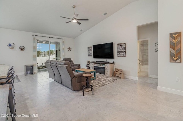 living room with high vaulted ceiling and ceiling fan