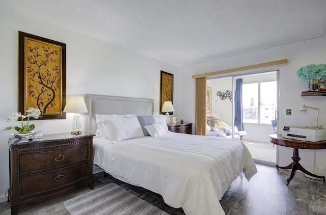 363 Wellington J, West Palm Beach, FL 33417 - bedroom featuring hardwood / wood-style floors and a textured ceiling