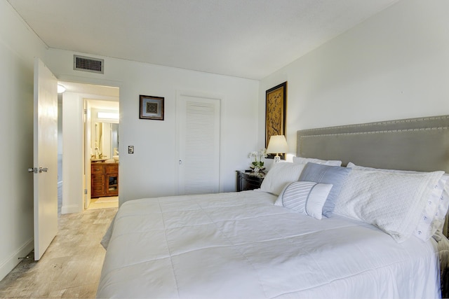 363 Wellington J, West Palm Beach, FL 33417 - bedroom featuring a closet and light hardwood / wood-style flooring