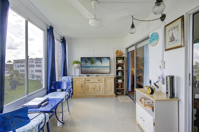 363 Wellington J, West Palm Beach, FL 33417 - living room with light tile patterned floors and ceiling fan
