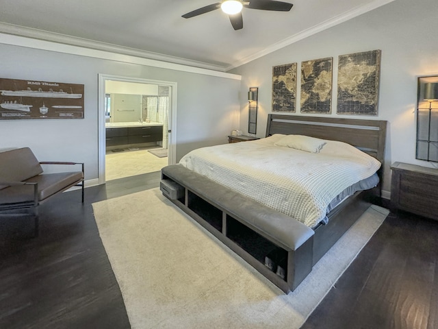 bedroom with ensuite bathroom, lofted ceiling, dark hardwood / wood-style flooring, ornamental molding, and ceiling fan