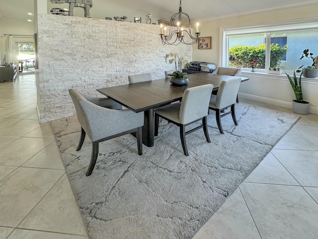 dining room with ornamental molding, a chandelier, and light tile patterned flooring